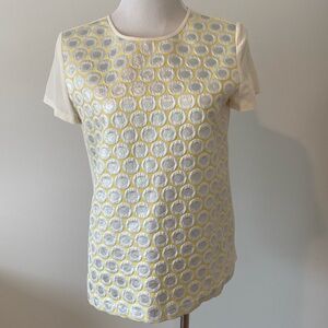 Women’s yellow and silver top.
